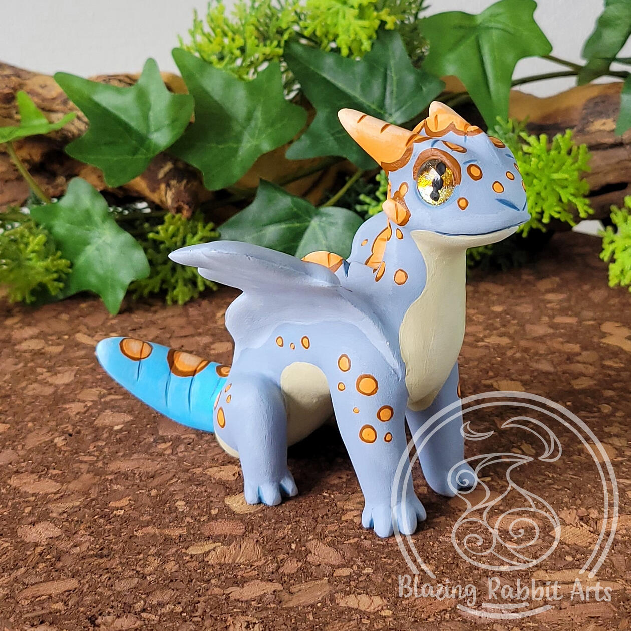 Sculpture of a blue gecko dragon