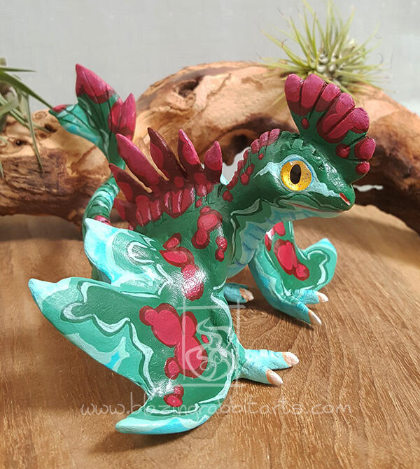 Sculpture of a wyvern in the colors of malachite.